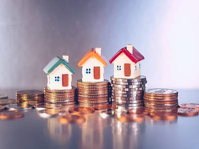 Miniature colorful house on stack coins using as property and financial concept - Shutterstock Miniature,Colorful,House,On,Stack,Coins,Using,As,Property,And - Shutterstock